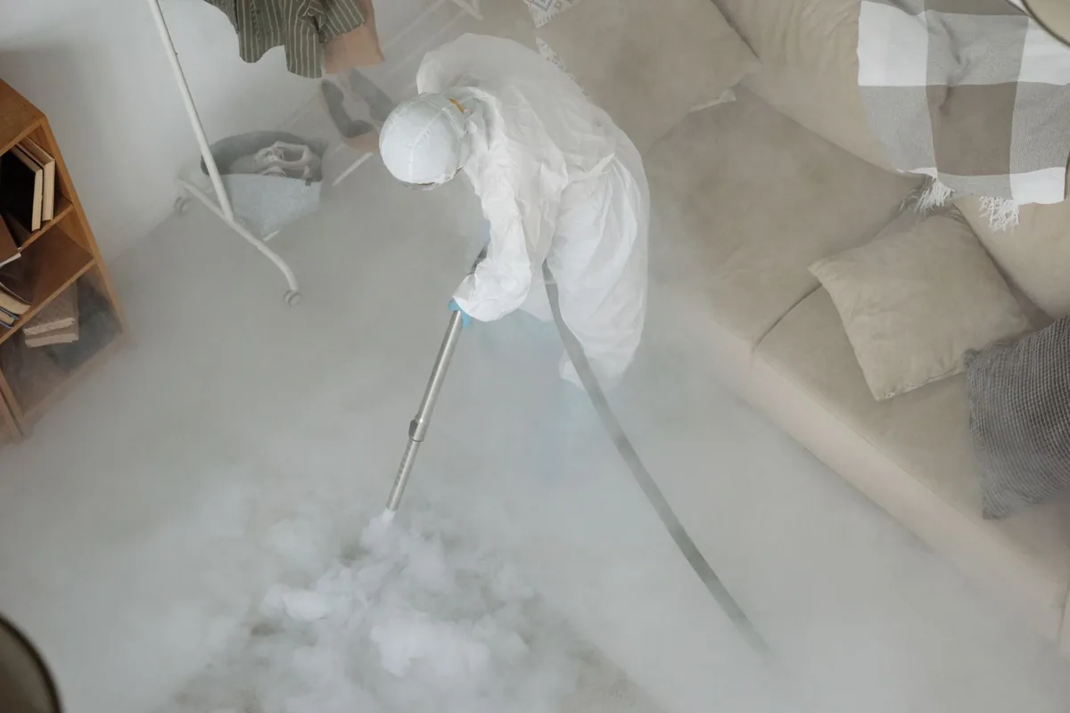 Biohazard cleanup technician in protective equipment, Hamlin, NY